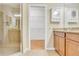 Bathroom offers a walk-in glass shower, granite countertops, and direct access to walk-in closet at 306 Coral Reef Way, Daytona Beach, FL 32124