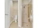 Bathroom boasts a modern shower with glass door and toilet room at 306 Coral Reef Way, Daytona Beach, FL 32124