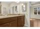 Bathroom has a double sink vanity with granite countertops and a view to a bedroom at 306 Coral Reef Way, Daytona Beach, FL 32124
