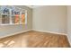 Bright bedroom with wood flooring, a large window, and natural light at 306 Coral Reef Way, Daytona Beach, FL 32124