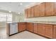 Bright kitchen with granite counters, tile floors, and wooden cabinets at 306 Coral Reef Way, Daytona Beach, FL 32124