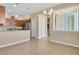 Bright kitchen features stainless steel appliances, granite counters, and wood cabinets, perfect for cooking and entertaining at 306 Coral Reef Way, Daytona Beach, FL 32124