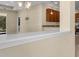 View of the kitchen bar showcasing granite counters and an open layout, perfect for entertaining at 306 Coral Reef Way, Daytona Beach, FL 32124