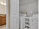 Convenient laundry room features washer and dryer and bathroom at 306 Coral Reef Way, Daytona Beach, FL 32124