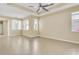 Bright living room with lots of natural light, tile flooring, and tray ceilings at 306 Coral Reef Way, Daytona Beach, FL 32124