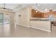 Open floor plan with tile flooring, recessed lighting, ceiling fan, and kitchen access provides ample space at 306 Coral Reef Way, Daytona Beach, FL 32124