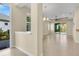 Bright living room boasts tile floors, neutral walls, and sliding doors to the outdoors at 306 Coral Reef Way, Daytona Beach, FL 32124