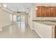 An open living space showcases tile floors, recessed lighting, and access to a screened lanai at 306 Coral Reef Way, Daytona Beach, FL 32124