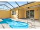 Enclosed pool area with brick floors at 306 Coral Reef Way, Daytona Beach, FL 32124