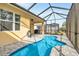 Pool area with an outdoor kitchen and dining space at 306 Coral Reef Way, Daytona Beach, FL 32124