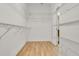 Spacious walk-in closet boasts wood floors and ample wire shelving at 306 Coral Reef Way, Daytona Beach, FL 32124