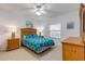 Bedroom with a bed, ceiling fan, and nightstands at 5300 S Atlantic Ave # 8-303, New Smyrna Beach, FL 32169