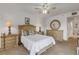 Comfortable bedroom featuring neutral colors and dresser with mirror at 5300 S Atlantic Ave # 8-303, New Smyrna Beach, FL 32169