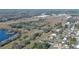 Wide shot of the property and surrounding neighborhood near an airport at 1428 Willow Oak Dr, Edgewater, FL 32132