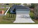 Property featuring a large hangar-style garage and spacious lot at 1428 Willow Oak Dr, Edgewater, FL 32132