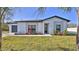 Modern home exterior with stone accents and landscaping at 1428 Willow Oak Dr, Edgewater, FL 32132