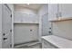 Laundry room with white cabinets and countertop space at 1428 Willow Oak Dr, Edgewater, FL 32132