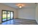 Living room with sliding glass doors opening to backyard at 1428 Willow Oak Dr, Edgewater, FL 32132