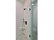 Modern shower with white tile and built-in seat at 1428 Willow Oak Dr, Edgewater, FL 32132