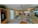 Spacious living room with comfortable seating, and open kitchen at 2700 N Peninsula Ave # 322, New Smyrna Beach, FL 32169