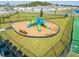 Community playground features colorful slides and a swing set on cushioned woodchips at 5226 Hophorn Dr, Edgewater, FL 32141