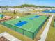 Aerial view of community basketball and play area, fostering an active lifestyle at 5226 Hophorn Dr, Edgewater, FL 32141