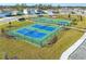 Community sports courts with basketball and tennis areas, perfect for staying active outdoors at 5226 Hophorn Dr, Edgewater, FL 32141