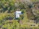 Aerial view of home with large backyard and pond at 1035 S State Road 415, New Smyrna Beach, FL 32168