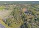 Aerial view of property with pond and highway access at 1035 S State Road 415, New Smyrna Beach, FL 32168