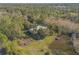 House nestled in nature with a pond nearby at 1035 S State Road 415, New Smyrna Beach, FL 32168