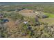 Aerial view of home on spacious lot with pond at 1035 S State Road 415, New Smyrna Beach, FL 32168