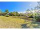 Spacious backyard with pond and lush landscaping at 1035 S State Road 415, New Smyrna Beach, FL 32168