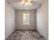 Spacious bedroom with tile floors and large window at 1035 S State Road 415, New Smyrna Beach, FL 32168