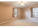 Simple bedroom with tile floor, ceiling fan, and neutral walls at 1035 S State Road 415, New Smyrna Beach, FL 32168