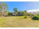 Single-story home with a large grassy yard at 1035 S State Road 415, New Smyrna Beach, FL 32168