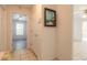 Clean hallway with tile floors and access to bedroom at 1035 S State Road 415, New Smyrna Beach, FL 32168