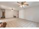 Open living room with tile floors and multiple ceiling fans at 1035 S State Road 415, New Smyrna Beach, FL 32168