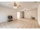 Bright living room with tile floors and access to other rooms at 1035 S State Road 415, New Smyrna Beach, FL 32168