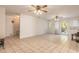 Large living room with tile floors and ceiling fans at 1035 S State Road 415, New Smyrna Beach, FL 32168