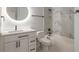 Bathroom with a bathtub, toilet and modern vanity at 1371 Melonie Trl, New Smyrna Beach, FL 32168