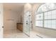 Elegant bathroom with marble flooring and a large walk-in shower at 1371 Melonie Trl, New Smyrna Beach, FL 32168