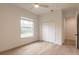 Bright bedroom with large window, hardwood floors, and spacious closet at 1371 Melonie Trl, New Smyrna Beach, FL 32168