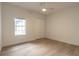 Simple bedroom with wood floors and ceiling fan at 1371 Melonie Trl, New Smyrna Beach, FL 32168