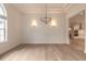 Elegant dining room with hardwood floors and a chandelier at 1371 Melonie Trl, New Smyrna Beach, FL 32168