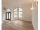 Bright dining area with hardwood floors and a chandelier at 1371 Melonie Trl, New Smyrna Beach, FL 32168