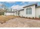 White house with a grey roof and arched windows at 1371 Melonie Trl, New Smyrna Beach, FL 32168