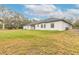 House exterior showcasing backyard and landscaping at 1371 Melonie Trl, New Smyrna Beach, FL 32168