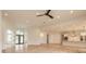 Open concept living room with hardwood floors and high ceilings at 1371 Melonie Trl, New Smyrna Beach, FL 32168