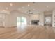 Bright and airy living room with hardwood floors and sliding doors at 1371 Melonie Trl, New Smyrna Beach, FL 32168