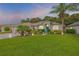 Well-manicured lawn and landscaping accentuate this beautiful single-story home with its vibrant turquoise door at 1768 Creekwater Blvd, Port Orange, FL 32128